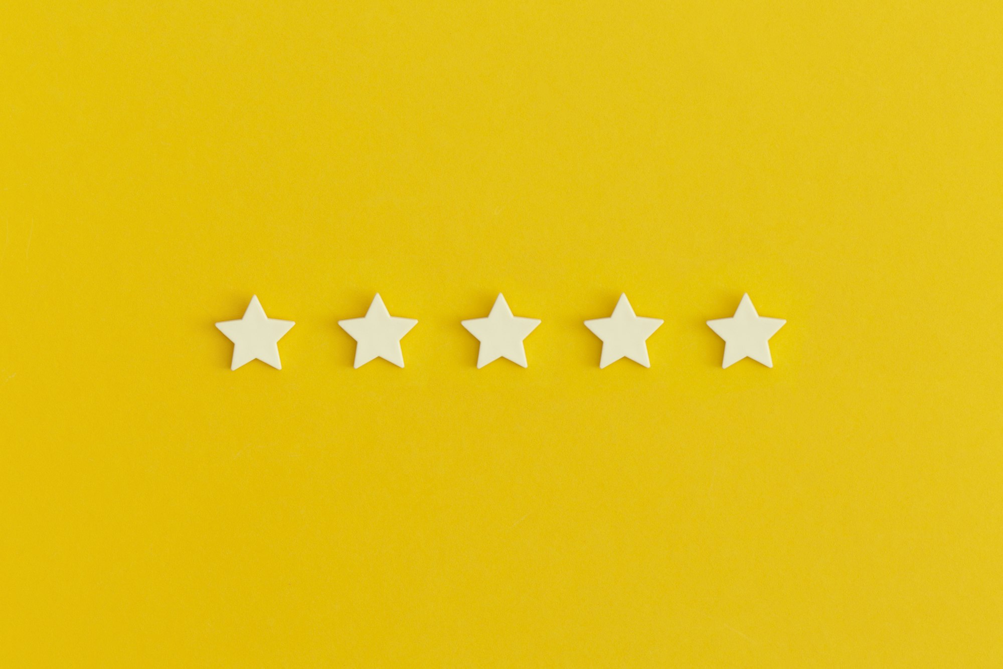 Five 5 stars, best excellent services rating on yellow background.