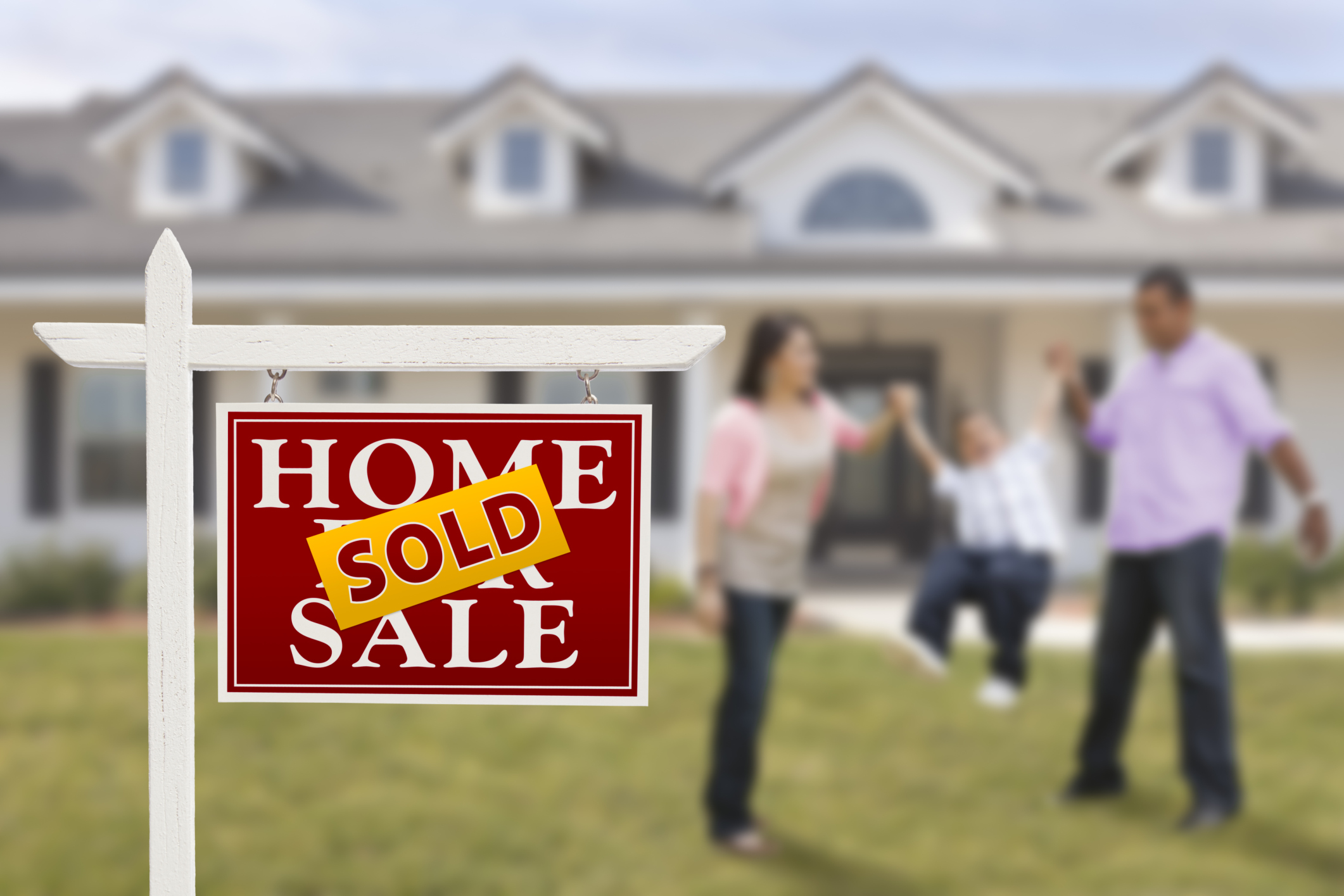 First-time home buyers reviewing mortgage options with a loan advisor