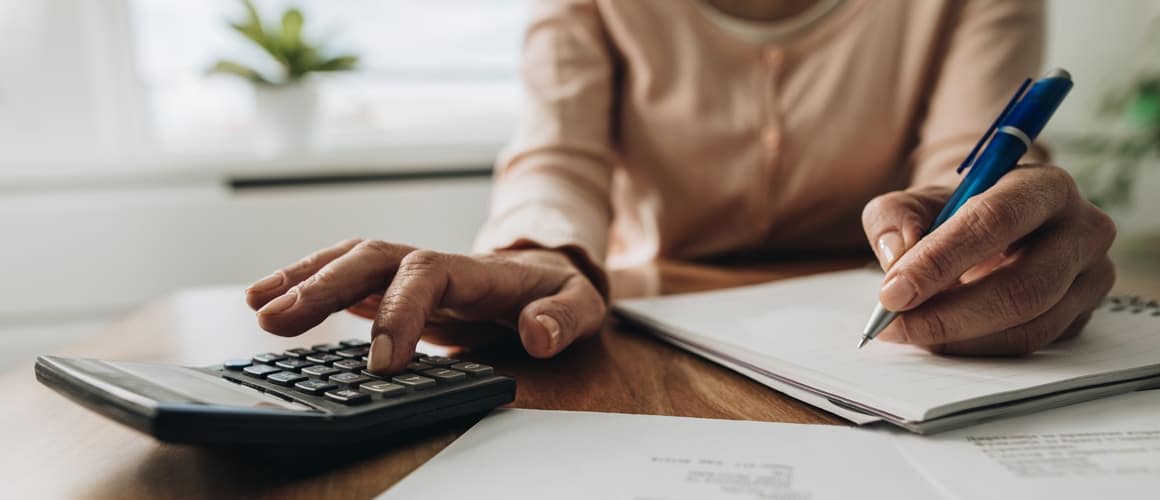 Homebuyer reviewing closing cost breakdown with lender